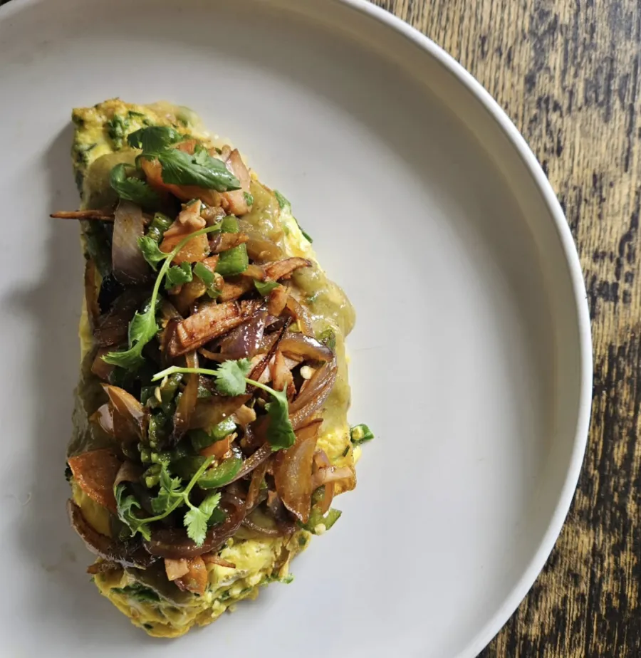 Herb omelette with caramelized onions and cilantro